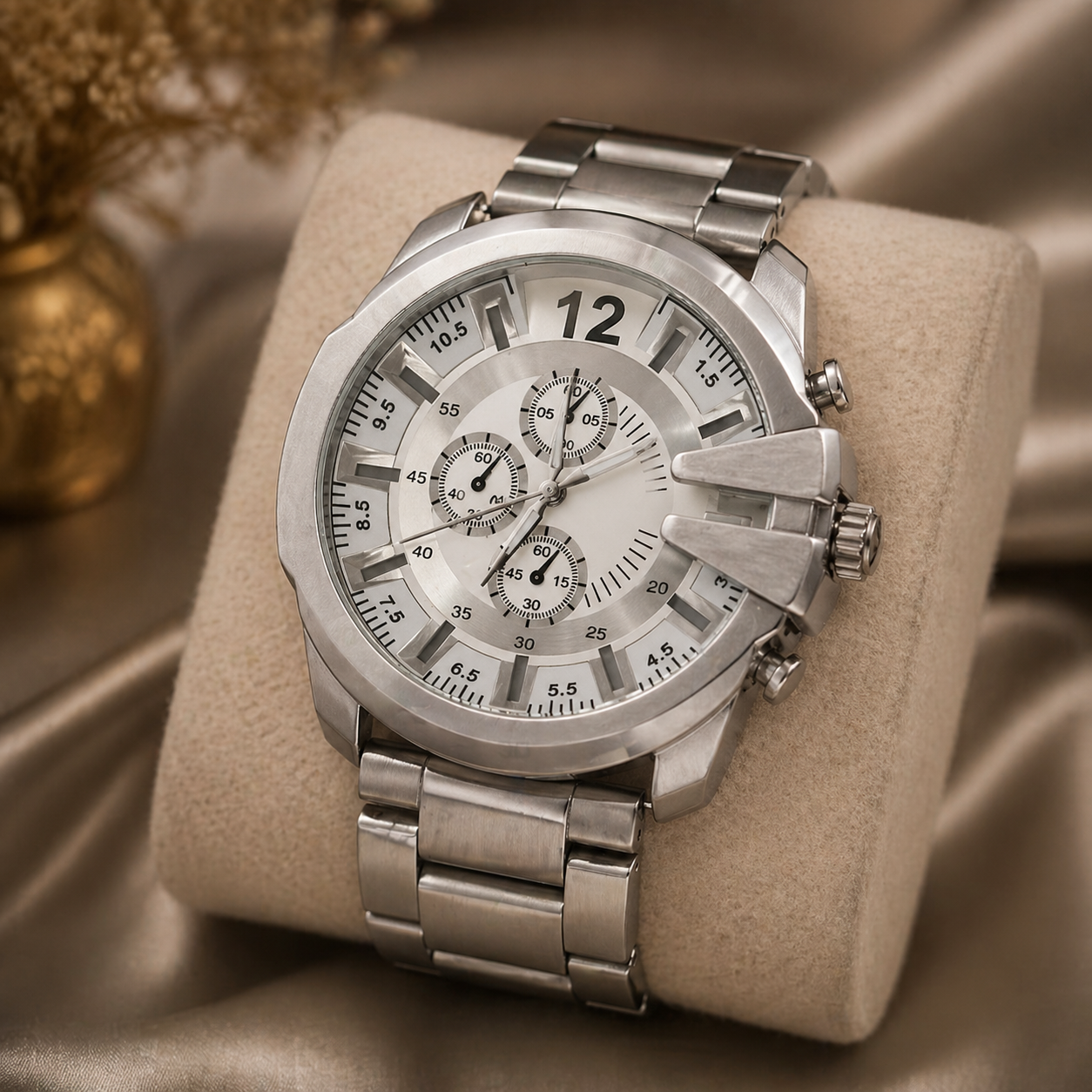 Bold silver dial watch with metal strap and chronograph-style design.